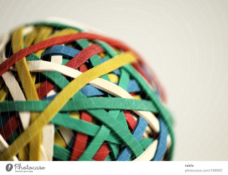 Give me some gum. . . . Work and employment Office work Packaging Rubber Elastic band rubber gun Plastic Sphere Network Round Blue Multicoloured Yellow Green