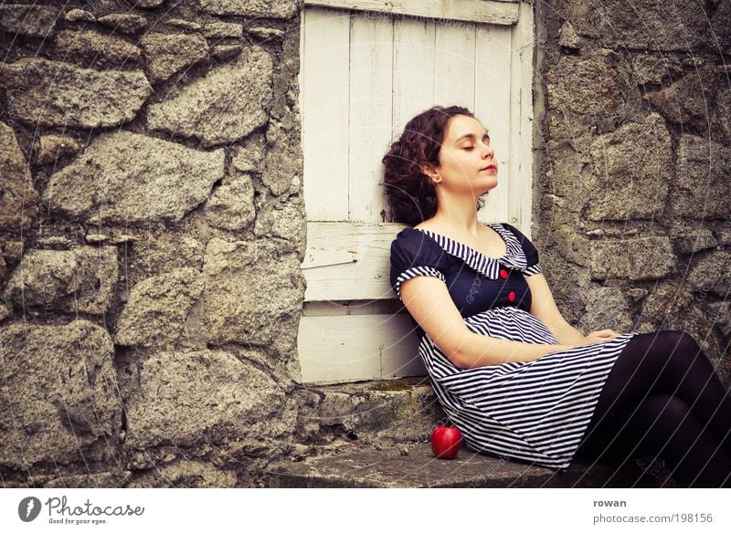 rest Human being Feminine Young woman Youth (Young adults) Woman Adults 1 Environment Relaxation Calm Break Apple Red Fruit Dress Wall (barrier) Door Garden