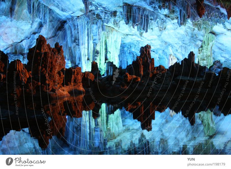 cave imaging Tourism Work of art Elements Lake Cave Tourist Attraction Stone Esthetic Blue Brown reed flute cave China Guilin stalagmite Stalactite