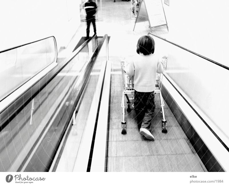 purchase sequence Escalator Shopping Trolley Child Push Supermarket Human being Black & white photo