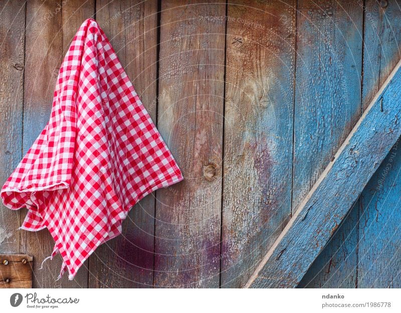 Red cloth in a cell hanging on a wooden cracked wall Design Kitchen Cloth Wood Old Blue White Surface Tablecloth whist napkin backdrop Consistency empty Menu