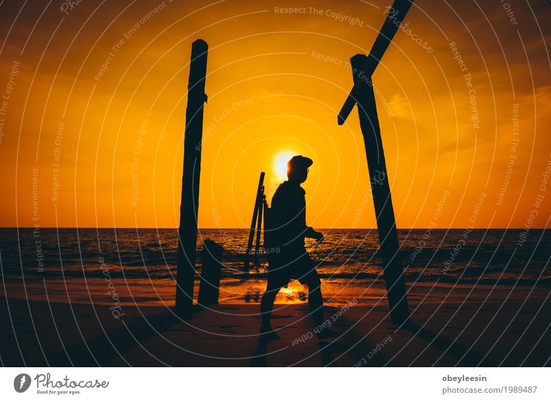 The silhouette of man walking alone at the beach Lifestyle Style Human being 1 30 - 45 years Adults Art Nature Landscape Waves Beach Bay Ocean Adventure Fear