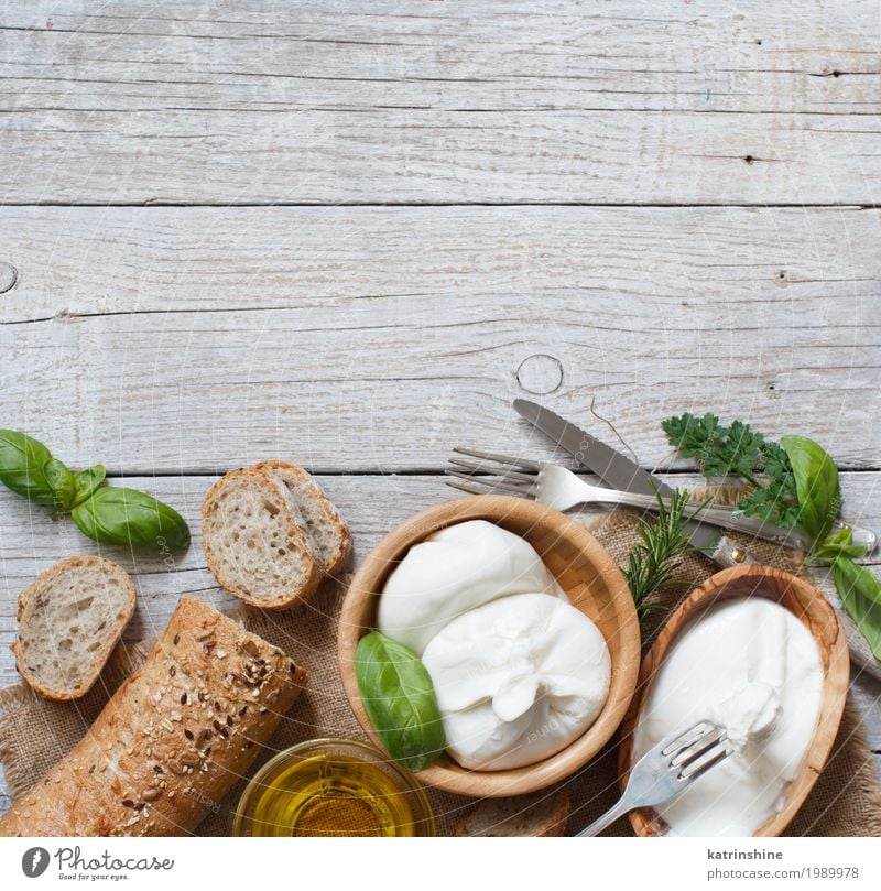 Italian cheese burrata, olive oil and bread top view Cheese Bread Herbs and spices Nutrition Vegetarian diet Italian Food Bowl Fork Wood Fresh Delicious Soft