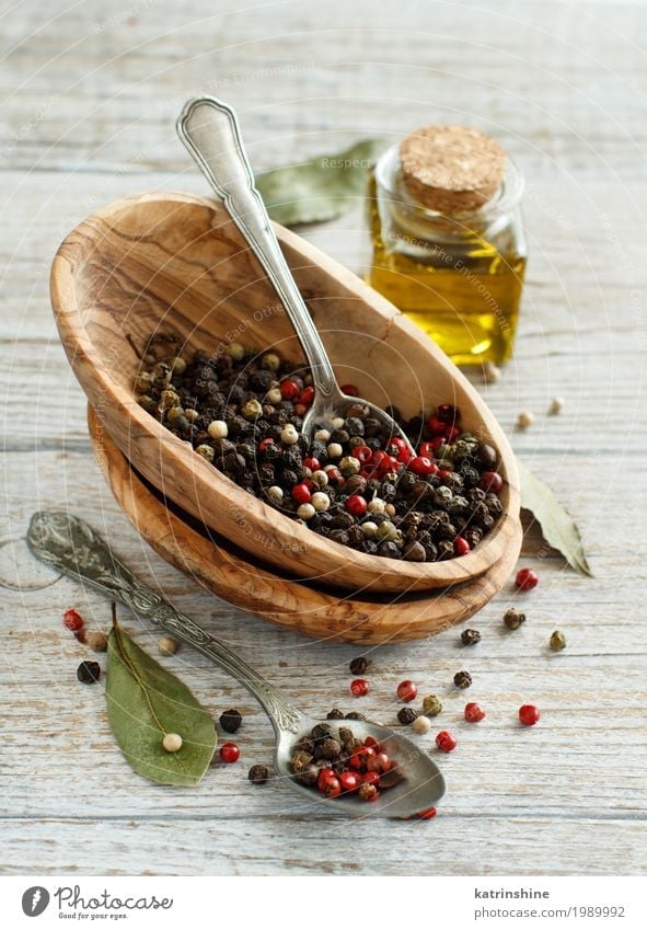 Peppercorn mix in a bowl, bay leaves and olive oil Herbs and spices Cooking oil Bowl Bottle Spoon Kitchen Green Red Black Aromatic asian border cook flavor food