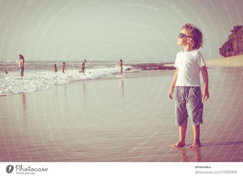 Happy little boy playing on the beach at the day time Lifestyle Joy Relaxation Leisure and hobbies Playing Vacation & Travel Trip Adventure Freedom Summer Sun