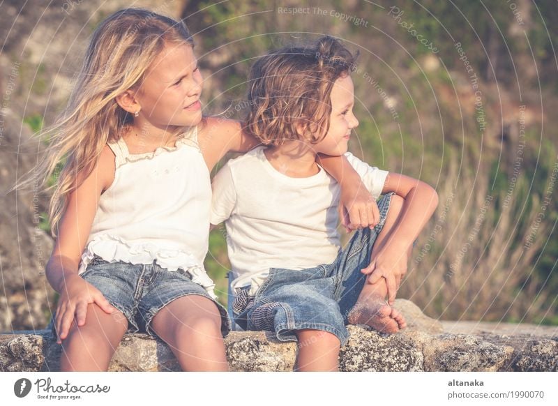 Sister and brother playing on the beach at the day time. Concept Brother And Sister Together Forever Lifestyle Joy Happy Beautiful Relaxation