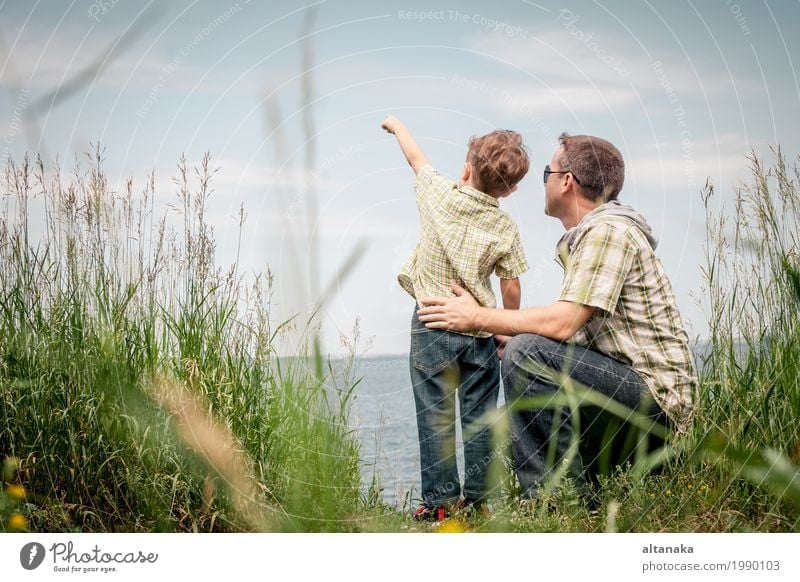 Father and son playing at the park near lake at the day time. Lifestyle Joy Relaxation Leisure and hobbies Playing Vacation & Travel Trip Freedom Summer Sun