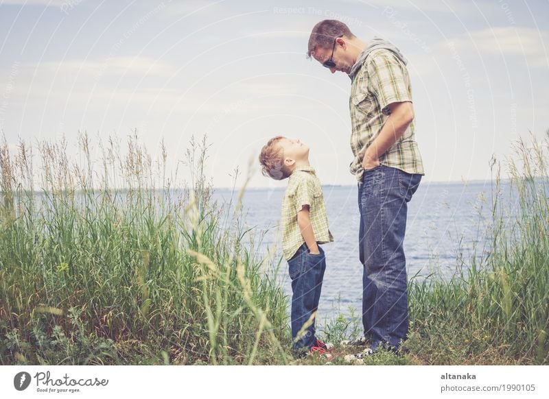 Father and son playing at the park near lake at the day time. Lifestyle Joy Relaxation Leisure and hobbies Playing Vacation & Travel Trip Freedom Summer Sun