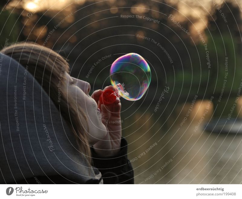 Being a child again - woman in profile blows a large soap bubble into the evening light Human being Youth (Young adults) Life Mouth 18 - 30 years Adults Sky