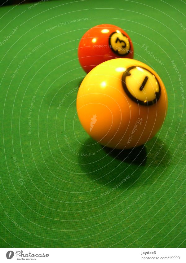 Two friends Leisure and hobbies Pool (game) Digits and numbers Green Billard bowle Yellow Colour photo Multicoloured Interior shot Close-up Detail