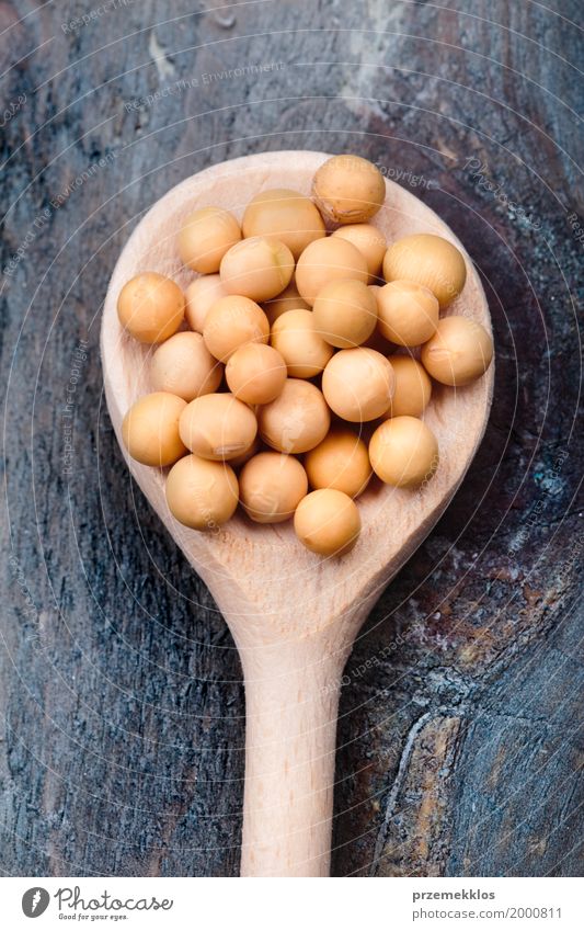 Soy beans on wooden spoon and wooden table Grain Nutrition Organic produce Vegetarian diet Spoon Wood Fresh Healthy Natural Beans Fiber food Ingredients Protein