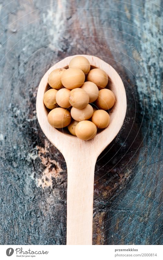 Soy beans on wooden spoon and wooden table Grain Nutrition Organic produce Vegetarian diet Diet Asian Food Spoon Wood Fresh Healthy Natural Beans Fiber food