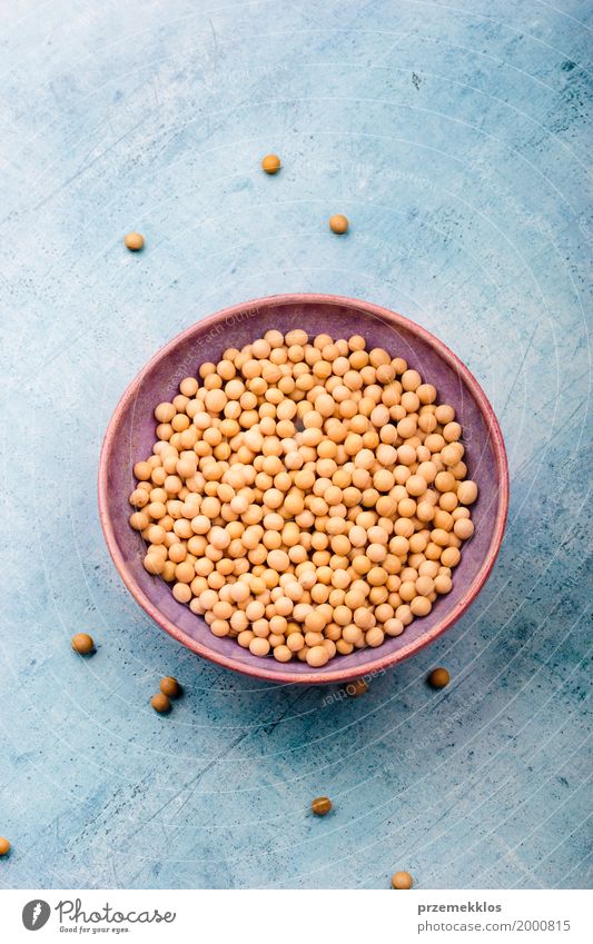 Soy beans in a bowl on table Grain Nutrition Organic produce Vegetarian diet Bowl Fresh Natural Beans Fiber food healthy Ingredients Protein Raw seed Vegan diet