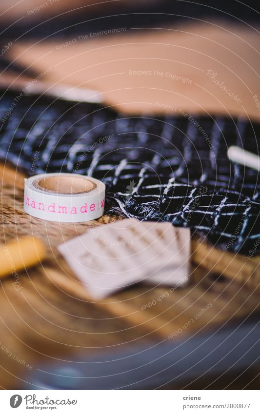 Close-up of tape which has "handmade" written on Lifestyle Design Leisure and hobbies Handcrafts Desk Table Profession Workplace Business SME Art Artist