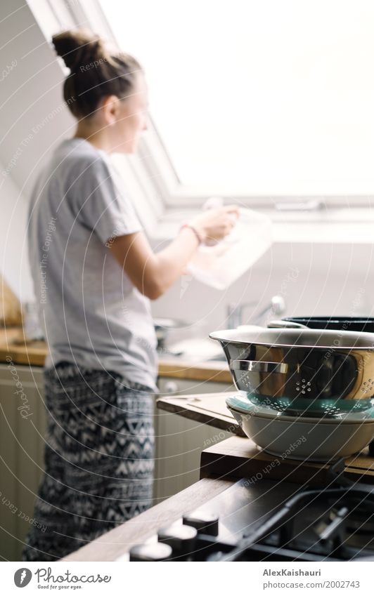 Young housewife washing the dishes Lifestyle Joy Flat (apartment) House (Residential Structure) Interior design Kitchen Young woman Youth (Young adults) Mother