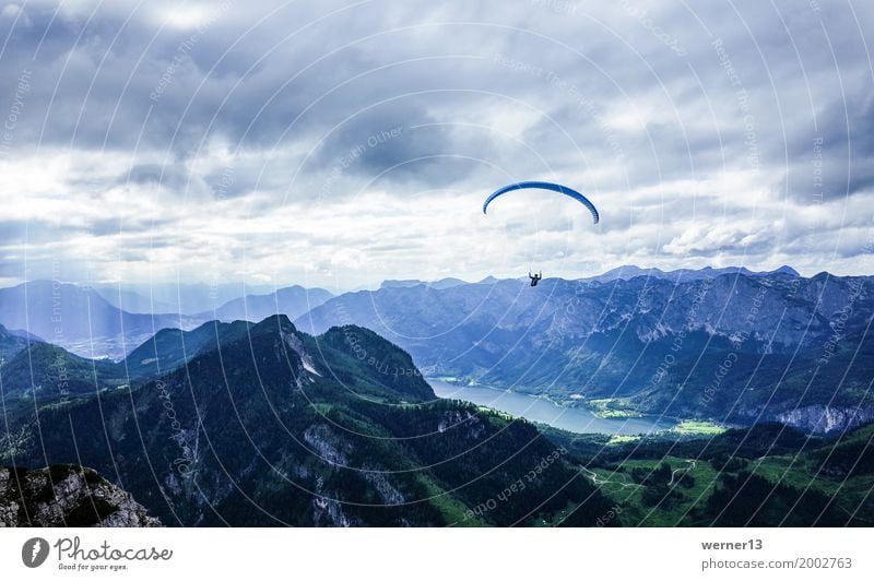 Paragliding in mountain and lake scenery Leisure and hobbies Vacation & Travel Autumn Alps Mountain Peak Flying Hiking Free Horizon Contrast Colour photo