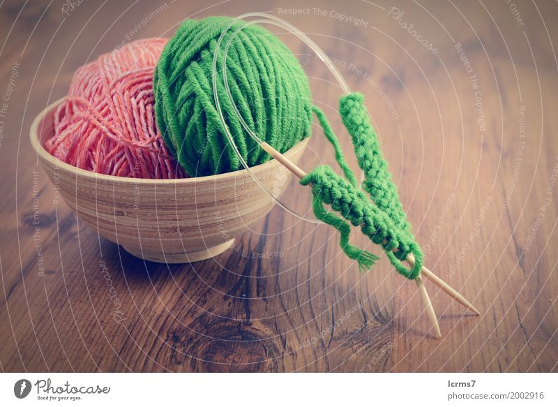 knitting with green wool in a bowl on wooden table Design Leisure and hobbies Winter Warmth Fashion Wool Knit Creativity creased yarn craft Background picture