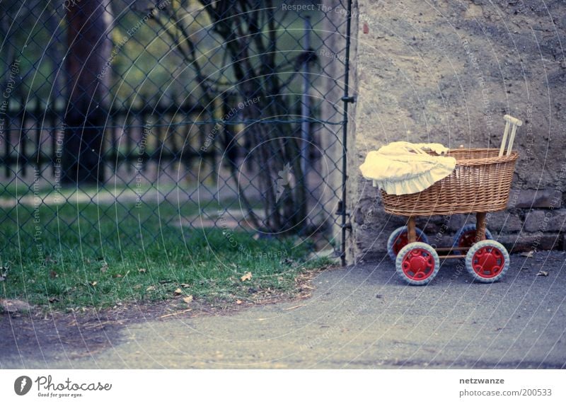off-road model Baby carriage Loneliness Colour photo Exterior shot Deserted Infancy Wire netting Fence Toys Basket Forget Day