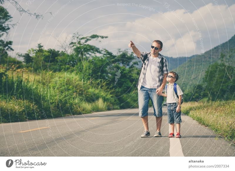 Father and son walking on the road at the day time Lifestyle Joy Happy Leisure and hobbies Vacation & Travel Trip Adventure Freedom Summer Mountain Hiking Child
