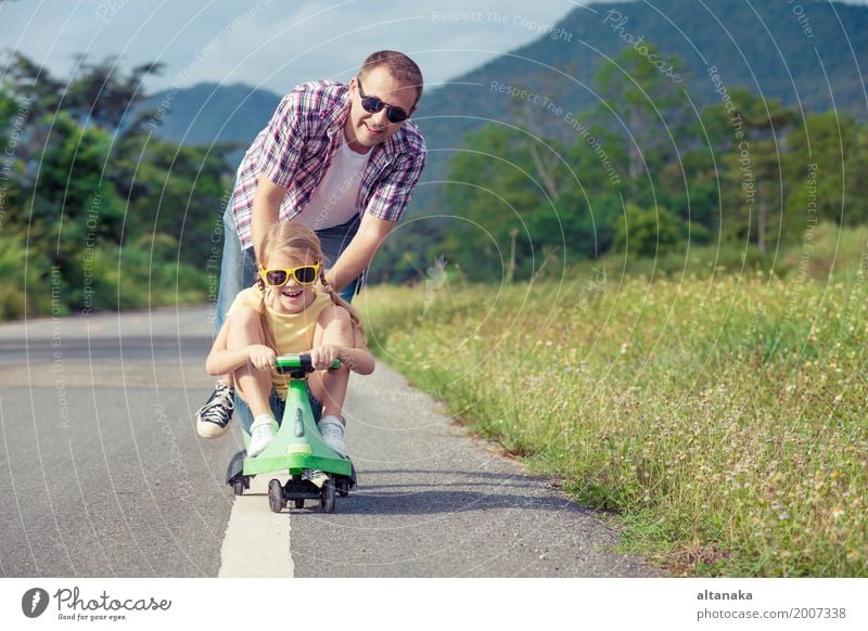 Father and daughter playing on the road at the day time. Lifestyle Summer Hiking Human being Child Girl Man Adults Family & Relations 2 3 - 8 years Infancy