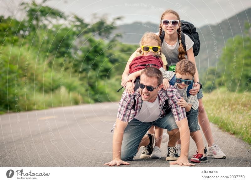 Father and children walking on the road at the day time. Lifestyle Joy Happy Leisure and hobbies Vacation & Travel Trip Adventure Freedom Summer Mountain Hiking
