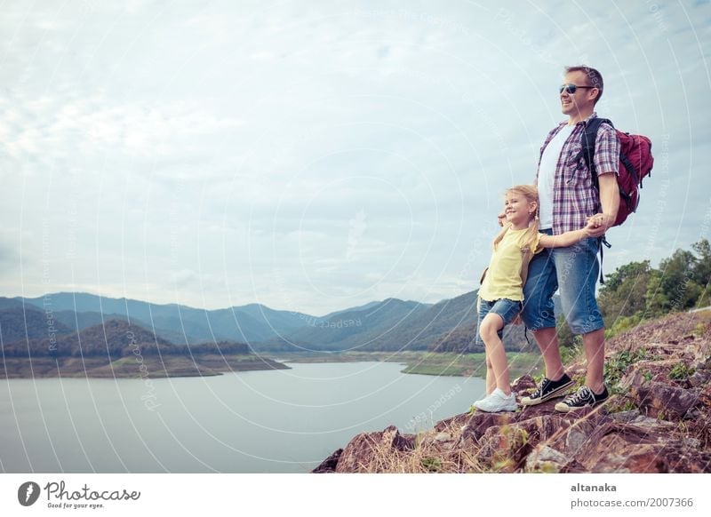 Father and daughter standing near the lake at the day time. Lifestyle Joy Happy Leisure and hobbies Vacation & Travel Trip Adventure Freedom Summer Mountain