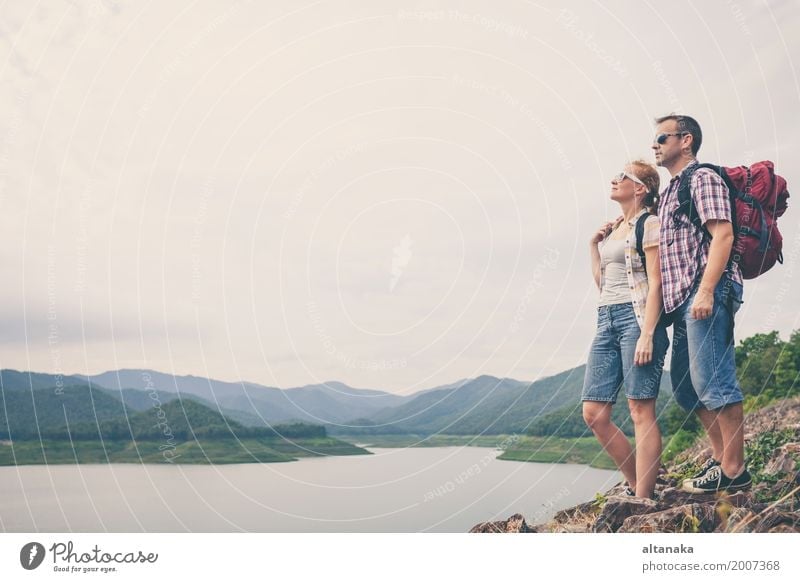 Happy family standing near the lake at the day time. Lifestyle Joy Relaxation Leisure and hobbies Vacation & Travel Trip Adventure Freedom Camping Summer Beach
