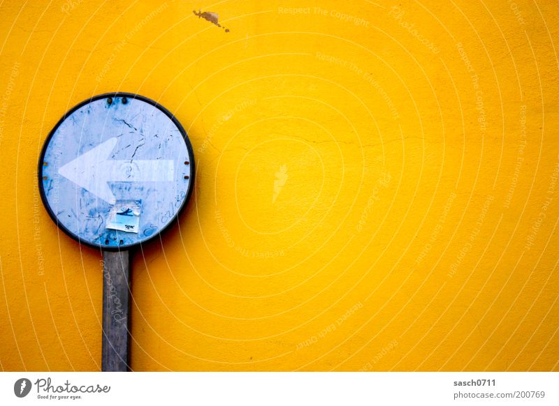 left outside Street Road sign Sign Arrow Old Bright Round Blue Yellow Colour Decline Transience Colour photo Exterior shot Deserted Copy Space right