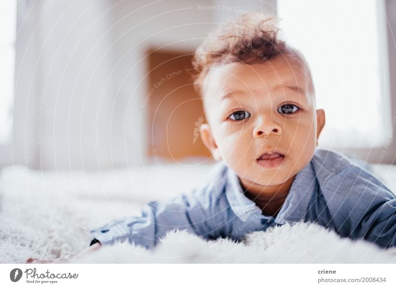 Cute male toddler laying on bed looking at camera Lifestyle Happy Child Masculine Baby Toddler Boy (child) Infancy 0 - 12 months Smiling Bright Small Offspring