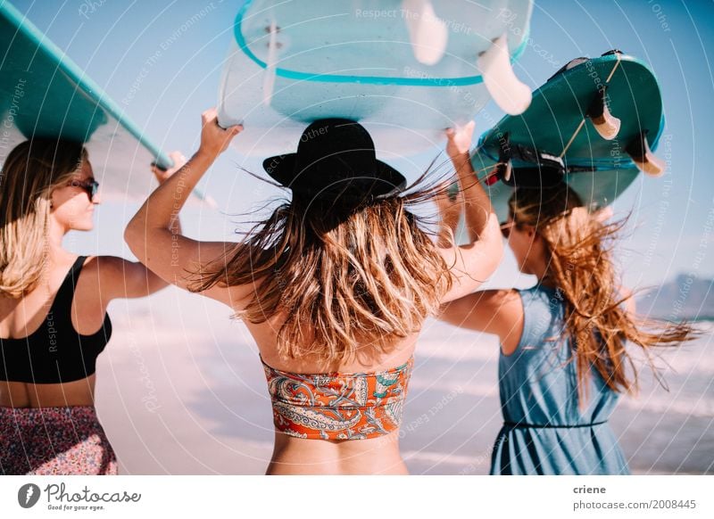 Group of young adult women carrying surfboards at beach Lifestyle Joy Relaxation Leisure and hobbies Vacation & Travel Adventure Freedom Summer Summer vacation