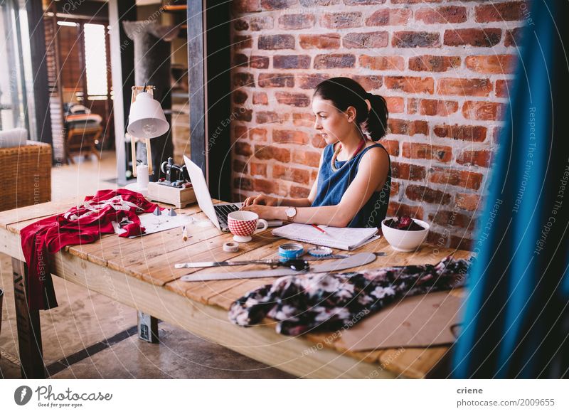 Young busineswoman working on laptop at desk in office Coffee Lifestyle Handcrafts Desk Work and employment Profession Workplace Office Factory Mail Business