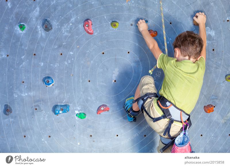 little boy climbing a rock wall indoor Joy Leisure and hobbies Playing Vacation & Travel Adventure Entertainment Sports Climbing Mountaineering Child Rope