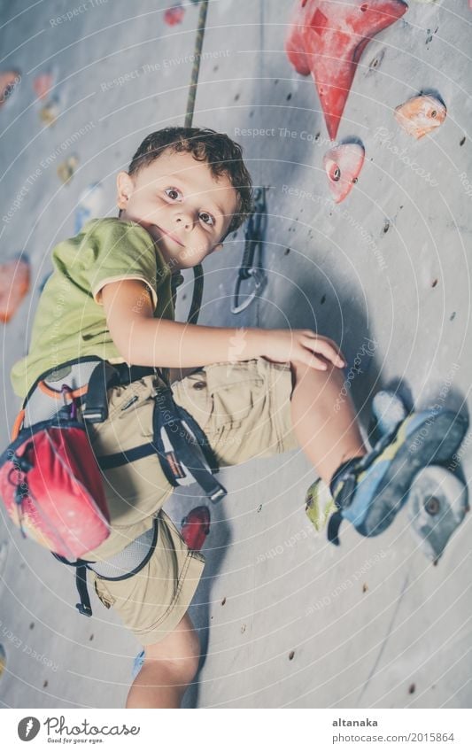 little boy climbing a rock wall indoor Joy Leisure and hobbies Playing Vacation & Travel Adventure Entertainment Sports Climbing Mountaineering Child Rope