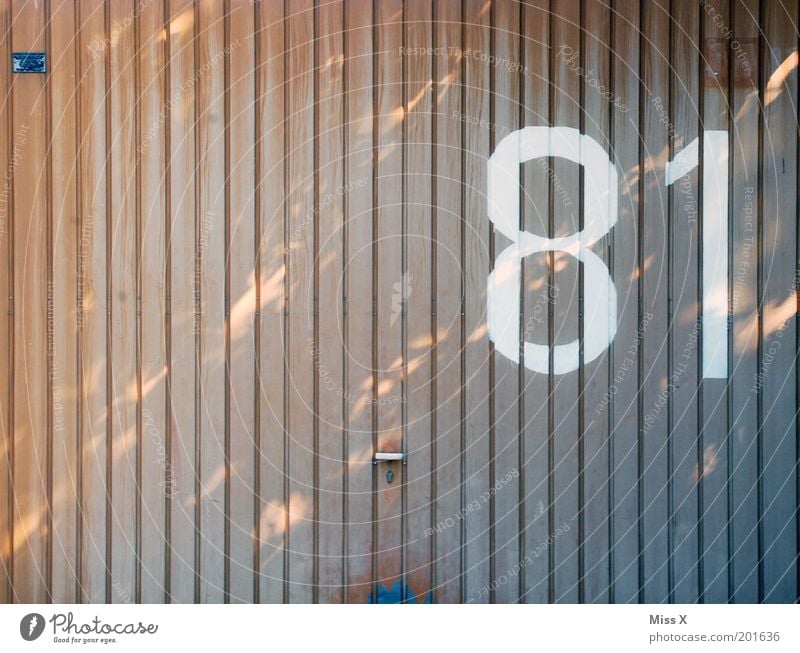 8 1 Door Sign Characters Large House number Garage Garage door Gate 81 Colour photo Subdued colour Exterior shot Deserted Copy Space left Copy Space top