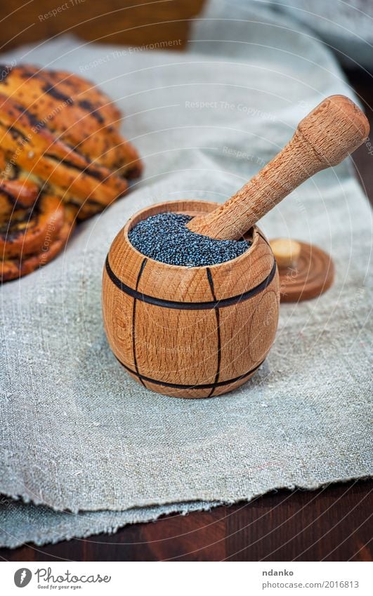 poppy seed in wooden containers Food Roll Dessert Herbs and spices Nutrition Eating Bowl Table Wood Fresh Natural Brown Gray Black Heap grain agriculture rolls
