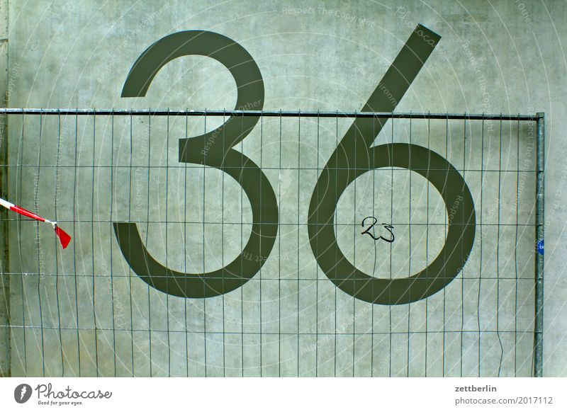 36/23 Digits and numbers House number Wall (barrier) Wall (building) Concrete Construction site Hoarding Fence Metalware Metal construction Closed Border