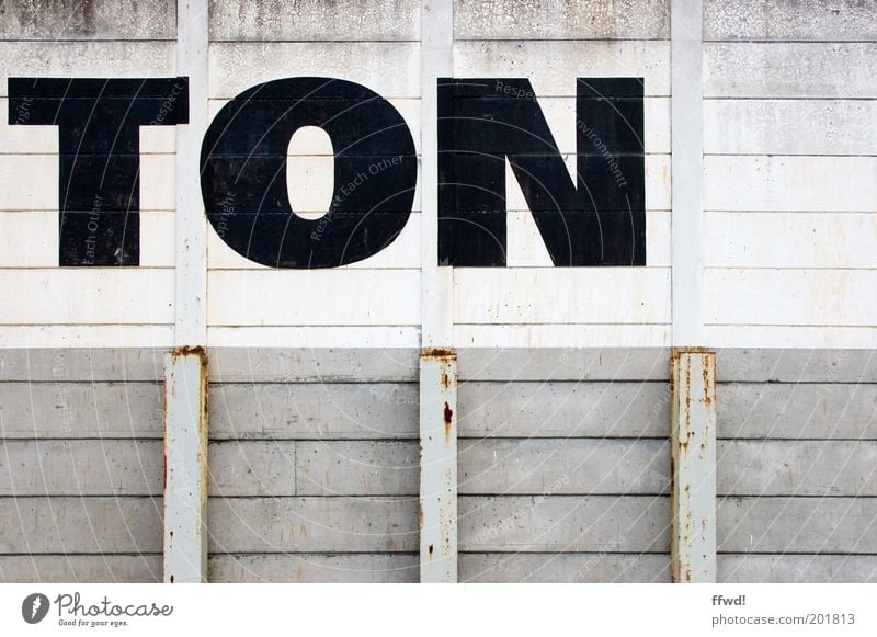 mono Industrial plant Manmade structures Building Wall (barrier) Wall (building) Facade Characters Old Dirty Simple Gloomy Gray Black White Typography Tone Rust