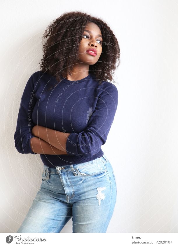 arabella Feminine Woman Adults 1 Human being Jeans Sweater Hair and hairstyles Brunette Long-haired Curl Afro Observe To hold on Looking Stand Beautiful