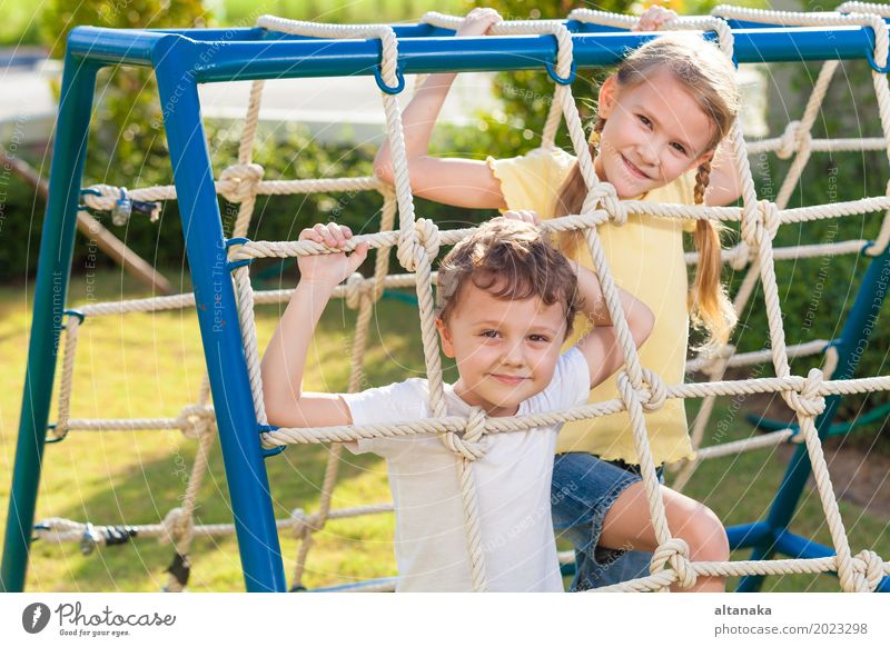 happy brother and sister playing on the playground Lifestyle Joy Happy Face Relaxation Leisure and hobbies Playing Vacation & Travel Adventure Summer Climbing