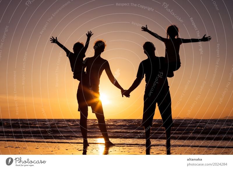 Silhouette of happy family Lifestyle Joy Leisure and hobbies Playing Vacation & Travel Trip Freedom Summer Sun Beach Ocean Child Boy (child) Woman Adults Mother