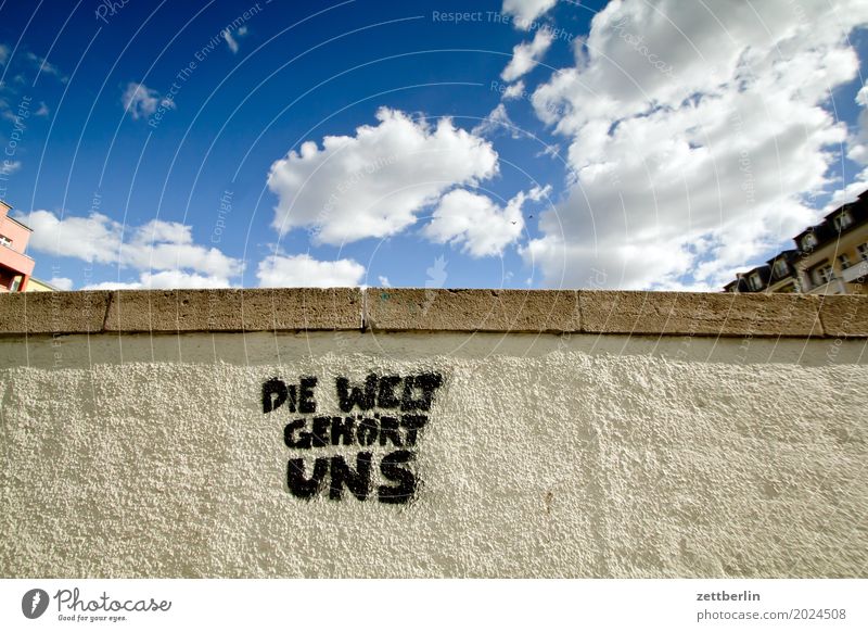 The world belongs to us Sky Heaven Downtown Wall (barrier) Wall (building) Plaster Rough Deserted Town Copy Space City life Weather Summer Clouds Characters