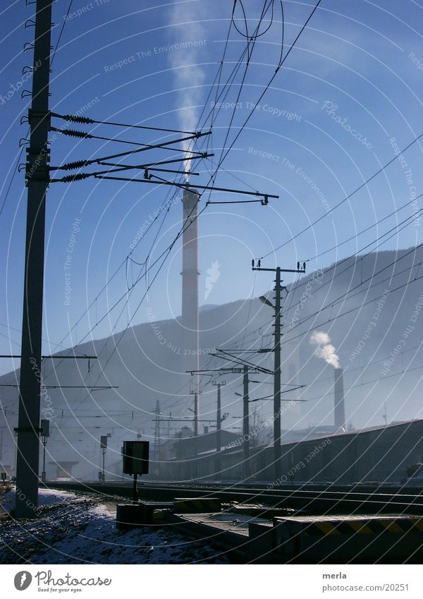 between fog and sky blue Railroad tracks Electricity High-power current Environment Exhaust gas Emission Fog Electrical equipment Technology Train station Share