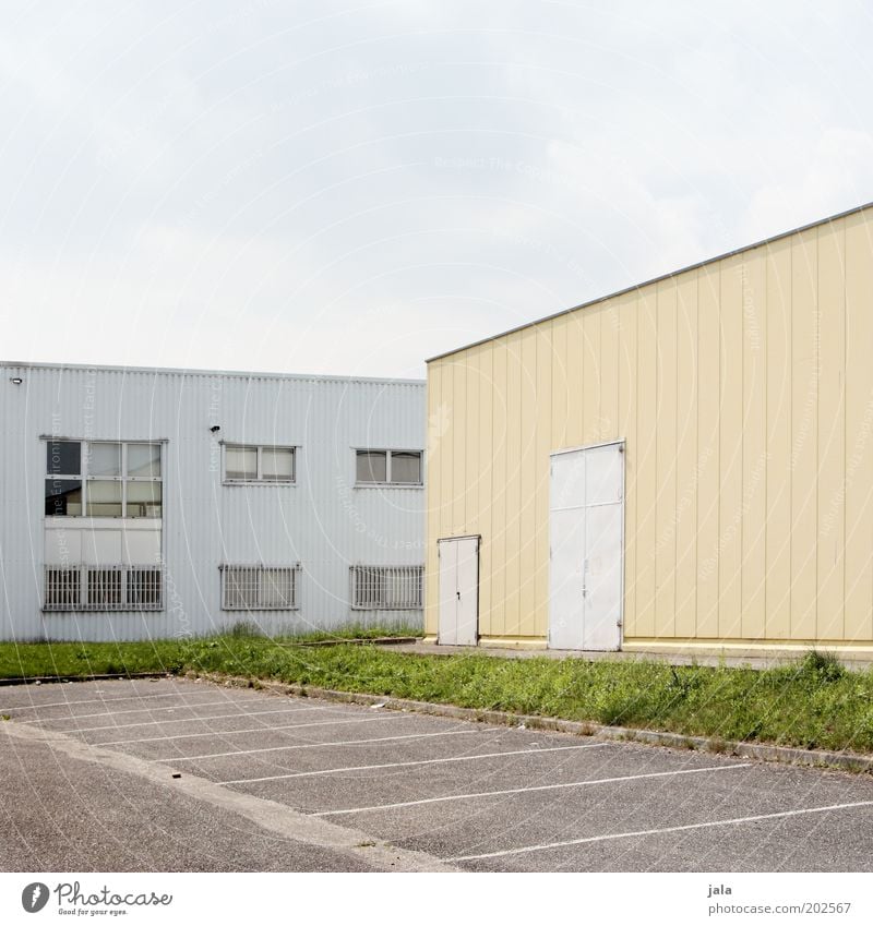 parking space Factory Industry Trade Company Sky Industrial plant Places Manmade structures Building Parking lot Facade Window Door Industrial zone Colour photo