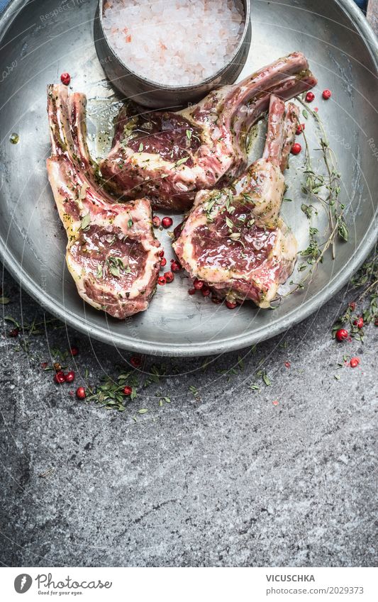 Marinated lamb chops for rumbling Food Meat Herbs and spices Cooking oil Nutrition Picnic Organic produce Crockery Style Design Healthy Eating Table Kitchen