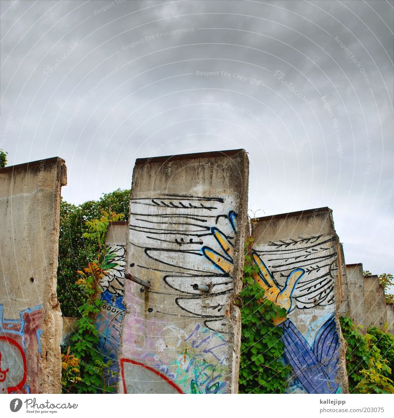 concrete heads Hand Fingers Wing Sign Graffiti Free Freedom The Wall Berlin Sky German Unification Day Colour photo Multicoloured Exterior shot GDR