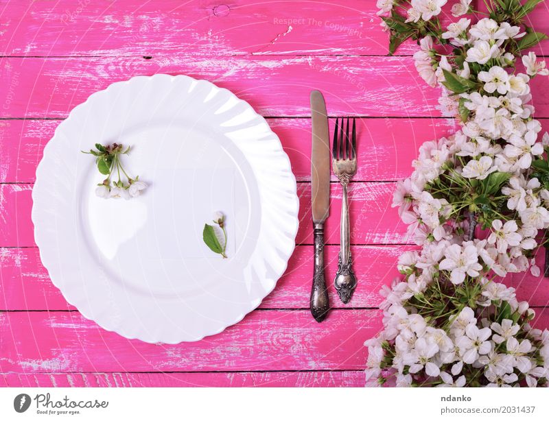 White dish on a pink wooden surface Lunch Dinner Plate Cutlery Knives Fork Table Kitchen Restaurant Flower Paper Wood Metal Steel Old Above Retro Pink Dish Meal