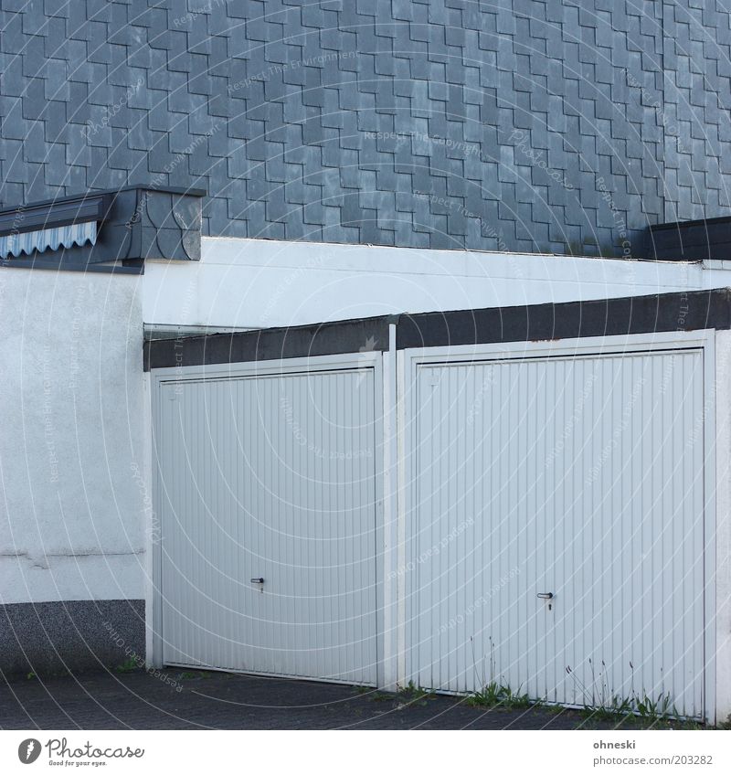 Closed Wall (barrier) Wall (building) Facade Garage Garage door Safety Subdued colour Pattern Structures and shapes Central perspective White 2 Deserted