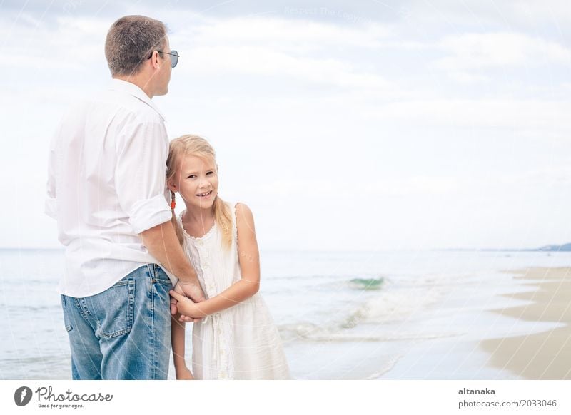 Mother and daughter doing yoga exercises on the beach. - a Royalty Free  Stock Photo from Photocase