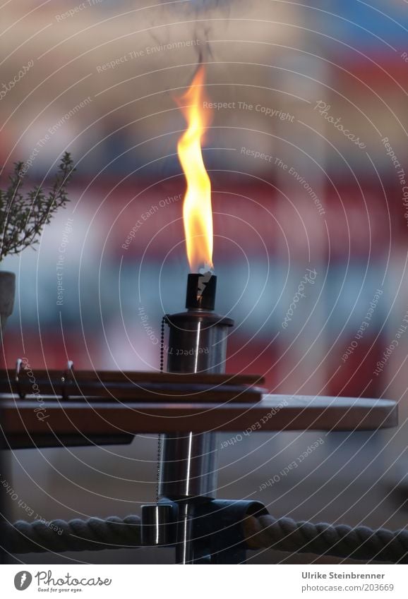 Stainless steel torch in restaurant Decoration Table Restaurant Fire Warmth Metal Illuminate Torch Cozy Inn Flame Burn Pillar Flare Rope Copy Space right