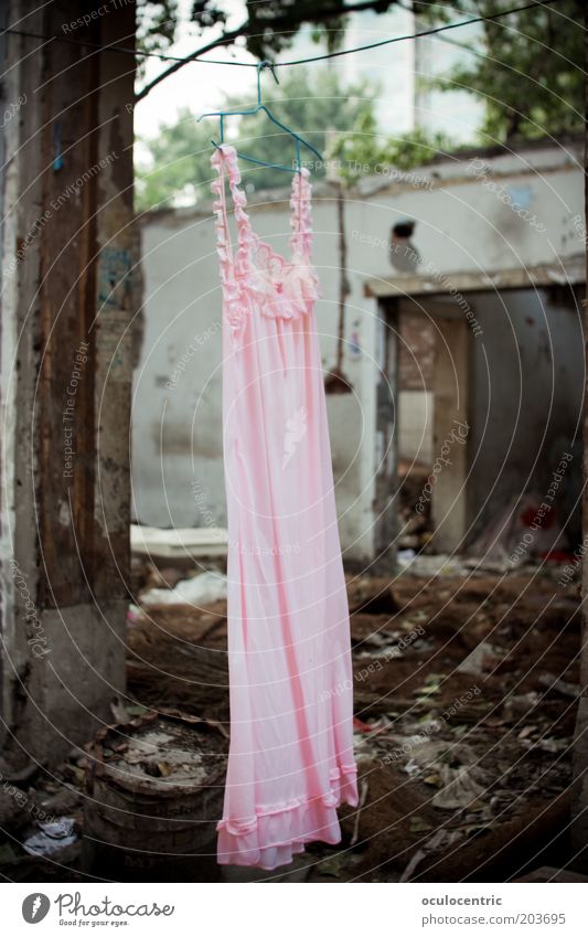 dryer broken Exhibition China Xian Asia Wall (barrier) Wall (building) Facade Dress Night dress Bizarre Whimsical Ruin Destruction Derelict Pink Gray Trash